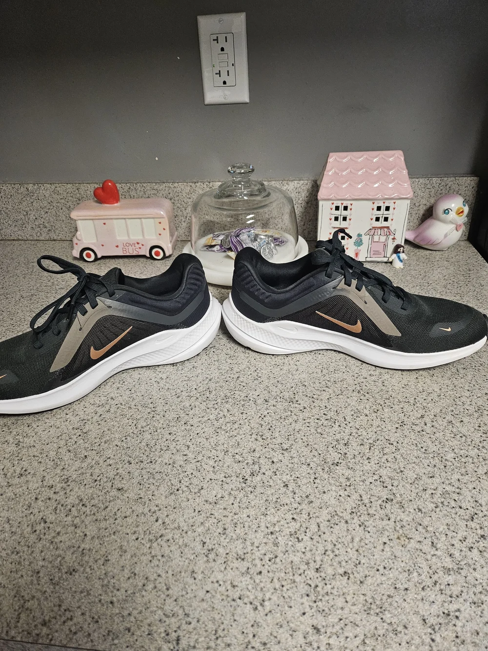 Nike Women's Black Running Shoes with Metallic Orange Swoosh